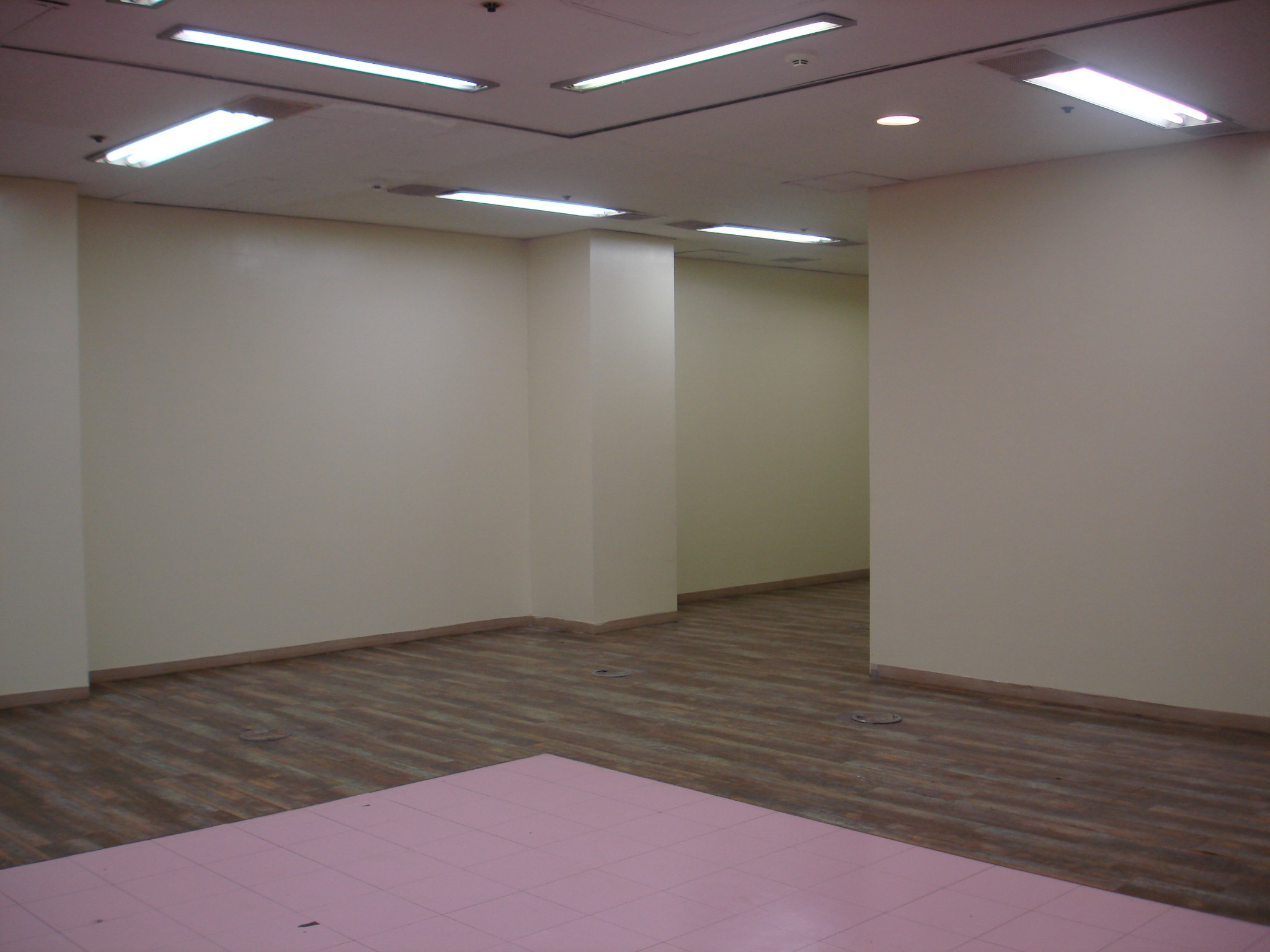 Empty interior with a pink tiled floor
